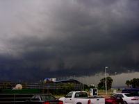 Daytona Beach International Airport (DAB) - Evening storm looking from Airport Parking lot toward speedway - by Florida Metal