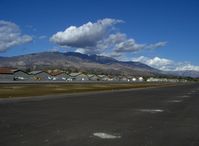 Santa Paula Airport (SZP) - Old Hangars, Santa Paula Peak in background. Elevation 4.917 ft. - by Doug Robertson