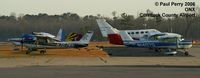 Enrique Adolfo Jiménez Airport - The ramp line-up.  Check out the tails - by Paul Perry
