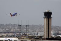 San Diego International Airport (SAN) - Southwest plane takeoff and tower - by Chuck Martinez