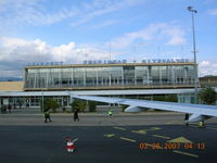 Perpignan Rivesaltes Airport - Terminal at Perpignan, France. No jet bridge. Stairs and walk across the ramp - rain or shine - by John J. Boling