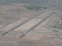 Nellis Afb Airport (LSV) - Home of the USAF's Thunderbirds... they're just visible on the ramp. - by John Meneely