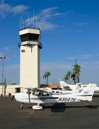 Falcon Fld Airport (FFZ) - Cessna 172 N3547H sits on theMesa ramp in front of the tower - by mikkelly@indigo.ie