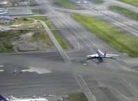 Ted Stevens Anchorage International Airport (ANC) - Boeing B747 cargo jet on taxiway. Taken from DHC-2 Beaver float plane N4444Z enroute to adjacent Lake Hood Sea Plane Base LHD. Blur across photo is copilot's window down edge. - by Doug Robertson