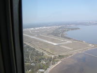 Mobile Downtown Airport (BFM) - Entering right downwind, RWY 14.  Mobile Bay at right. - by D. Luke