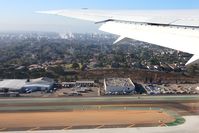 Los Angeles International Airport (LAX) - Imperial Hill viewing area as seen from Delta Airlines N832MH as we climbed out from RWY 25R enroute to Atlanta. - by Dean Heald