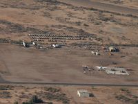 Gila River Memorial Airport (34AZ) - Winding down ... The concrete slab is where the T&G (Air Response) hangar used to be. Some PV2s and a compound full  of H-19s still in evidence. - by John Meneely