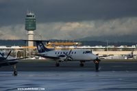 Vancouver International Airport, Vancouver, British Columbia Canada (YVR) - Winter time : Beech 1900 from Pacific Coastal at the South Terminal - Control Tower in the background - by Michel Teiten ( www.mablehome.com )
