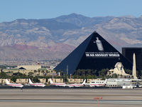 Mc Carran International Airport (LAS) - The EG&G Terminal with the Luxor. - by Brad Campbell