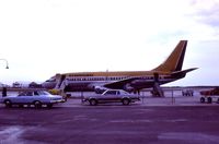 St Petersburg-clearwater International Airport (PIE) - Transair B737 CF-TAN early morning departure,June 1977 - by metricbolt