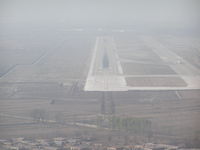 Taiyuan Wusu Airport, Taiyuan, Shanxi China (ZBYN) - Runway 31 at Taiyuan PRC, ZBYN/TYN. Haze/smog keeps vis low. - by John J. Boling