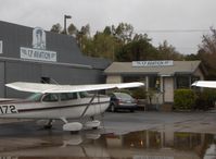 Santa Paula Airport (SZP) - CP Aviation, FBO offering flight instruction and aircraft maintenance. Hangar and Office. Part of CP's extensive flight line of aircraft on a rare, rainy day. - by Doug Robertson