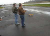 Santa Paula Airport (SZP) - RC Drone flights on a calm windless day near threshold to Rwy 04, Monoplane & Ornithopter flight controllers. Tiger Moth RC drone on deck. - by Doug Robertson