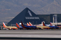 Mc Carran International Airport (LAS) - A flock of Yellowbirds and Bluebirds gather at the Luxor. - by Brad Campbell