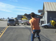 Santa Paula Airport (SZP) - Personal forms of SZP airport transportation include golf carts, motorcycles, motorscooters, bicycles, motorized bicycles and a ...UNICYCLE! Sammy Mason onboard. - by Doug Robertson