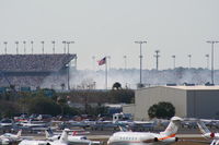 Daytona Beach International Airport (DAB) - Smoke from a crash on the track during Busch Race in background - by Florida Metal