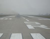 Indianapolis International Airport (IND) - Pulling on to 5R for take-off...we disappeared in a low ceiling right after leaving the ground. - by IndyPilot63