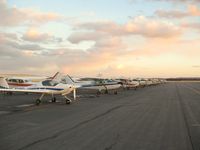 Centennial Airport (APA) - Ramp Hotel in the evening... long row of C172s... - by Victor Agababov