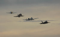 Nellis Afb Airport (LSV) - Here comes the Heritage Flight  - by J.G. Handelman