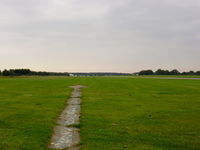 Earls Colne Airfield - a view down the runway from the passenger seat of the fire truck - by chris hall