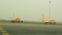 Soekarno-Hatta International Airport, Cengkareng, Banten (near Jakarta) Indonesia (WIII) - Adam Air aircraft awaiting re-po at Jakarta. - by John J. Boling