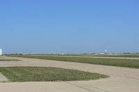 Fort Worth Spinks Airport (FWS) - Wide open spaces...looking north across the airfield...local Doppler RADAR dome on the east side of the field. - by Zane Adams