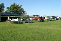 Antique Airfield Airport (IA27) - Antique Airplane lineup of the decade at Antique Airfield near Blakesburg, IA. Curtiss JN-4h Jenny, DeHavilland DH-4, Boeing 40C & Ford 4-AT-B Tri-motor - by BTBFlyboy