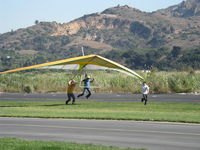 Santa Paula Airport (SZP) - Repealing the Law of Gravity-Hang Glider launching from level ground-Momentary liftoff with helping push - by Doug Robertson