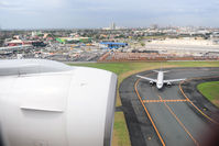 Ninoy Aquino International Airport - On final approach, just before landing .. within airport perimeter. - by BigDaeng