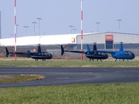 Liverpool John Lennon Airport, Liverpool, England United Kingdom (EGGP) - a lineup of Robinson R44's - by Chris Hall