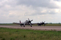 Tstc Waco Airport (CNW) - Skyraider and Bearcat taxi on the runway at the 1987 Waco Airshow - by Zane Adams