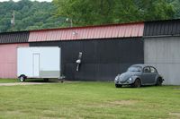Riverside Airport (OH36) - A little hanger art and a nice old VW at Zanesville Riverside - by Bob Simmermon