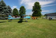 Beach City Airport (2D7) - Tail draggers lined up at the Father's Day fly-in at Beach City, Ohio - by Bob Simmermon