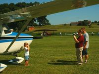 Beach City Airport (2D7) - Getting a pose in front of a vintage Cessna at the Father's Day fly-in. - by Megan Simmermon