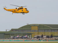 Anglesey Airport (Maes Awyr Môn) or RAF Valley, Anglesey United Kingdom (EGOV) - Sea King HAR.3 XZ591 and seven Hawks - by Chris Hall