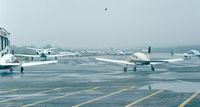 Groton-new London Airport (GON) - Groton-New London airport apron on a rainy day - by Ingo Warnecke