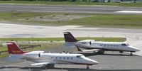 Princess Juliana International Airport, Philipsburg, Sint Maarten Netherlands Antilles (TNCM) - Both hopper jets park at the cargo ramp. hopper jet 88 &54 - by SHEEP GANG