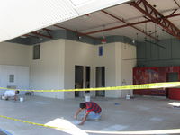 Santa Paula Airport (SZP) - 32 Curtiss Taxi-New hangar under construction. Tile floor installation. - by Doug Robertson