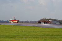 Manchester Airport, Manchester, England United Kingdom (EGCC) - Manchester Airport fire crews following Thomas Cook Boeing 757 G-FCLK down the runway, which made an emergency landing on one engine after an engine fire - by Chris Hall