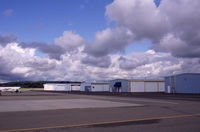Buchanan Field Airport (CCR) - Small hangars on the East Ramp near Concord. Pilots lounge at the blue awning.  - by Bill Larkins