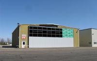 Chandler Field Airport (AXN) - Construction on a new hangar door. - by Kreg Anderson