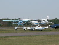 Blackbushe Airport, Camberley, England United Kingdom (EGLK) - VISITING CESSNA 206H N206MX AND RESIDENT CESSNA 182R G-ESSL TAXYING FOR DEPARTURE - by BIKE PILOT