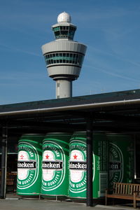 Amsterdam Schiphol Airport, Haarlemmermeer, near Amsterdam Netherlands (EHAM) - Schiphol control tower and an add for an average Dutch beer as seen from the observation platform. - by Henk van Capelle