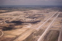Dallas/fort Worth International Airport (DFW) - DFW Airport under construction.  Old Kodachrome slide copied with Sony A200, - by Ron Streetenberger