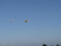 Santa Paula Airport (SZP) - N3G and N53EH on climb out departing the National Bucker Fly-In - by Doug Robertson