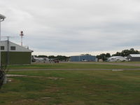 South St Paul Muni-richard E Fleming Fld Airport (SGS) - Airport Rotating Beacon, aircraft hangars - by Doug Robertson