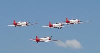 Wittman Regional Airport (OSH) - Aeroshell Aerobatic Team departing for the National Anthem. - by Kreg Anderson