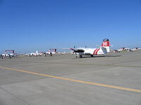 Mc Clellan Airfield Airport (MCC) - CAL FIRE/CDF S-2T and TS-2A tankers and OV-10 lead planes on ramp just prior to start of 2005 fire season (last year piston TS-2As in service) - by Steve Nation