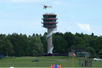 Malmen Air Base - The tower of Malmen Air Base with the Thulin A (Bleriot XI) of Mikael Carlson flying above it during the 2010 Open Day. - by Henk van Capelle