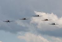 Willow Run Airport (YIP) - T-6s in formation with a single BT-13 - by Florida Metal